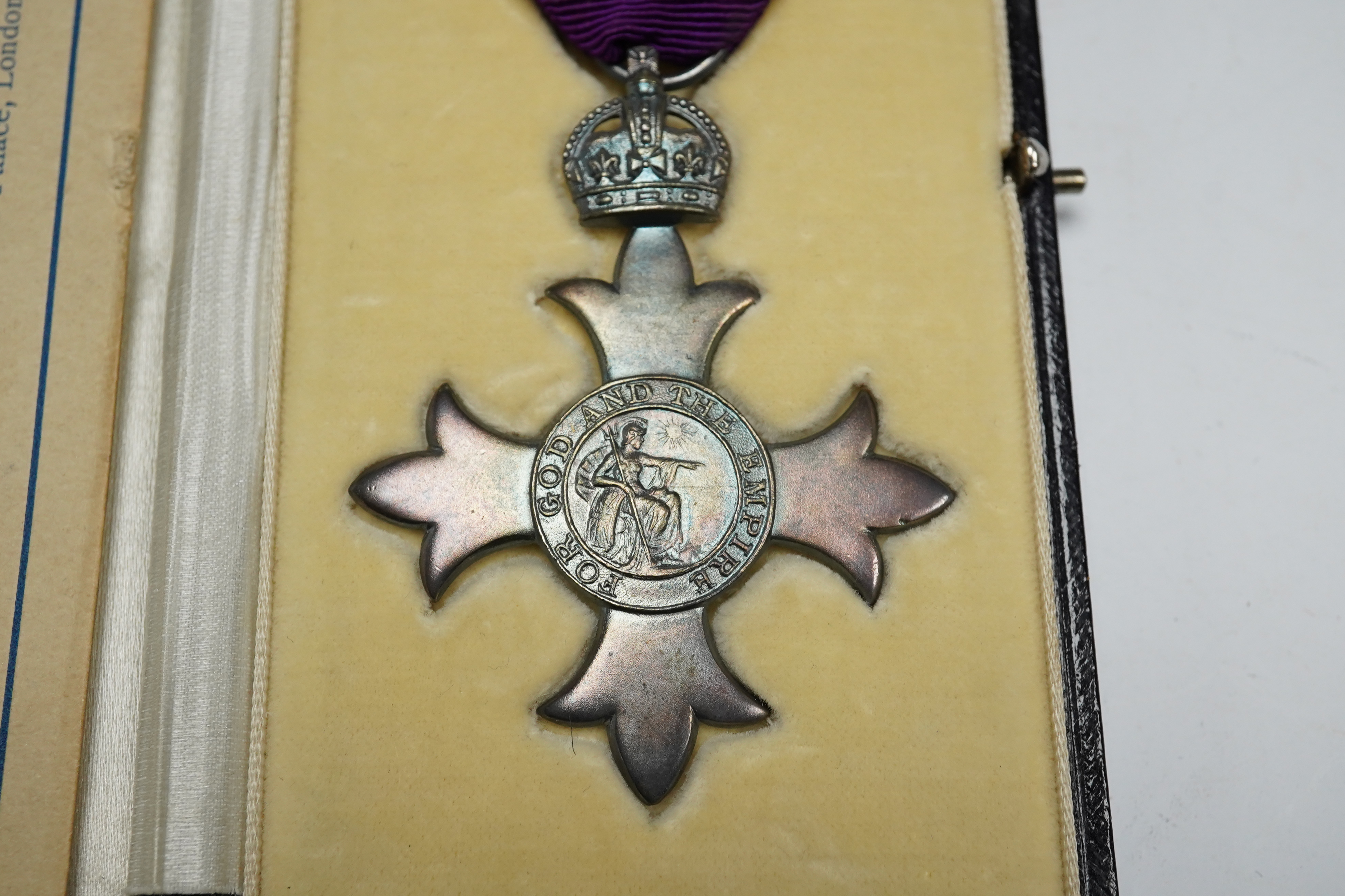 Order of the British Empire civil M.B.E. With first type purple ribbon, George V sterling silver by Garrards, hallmark for 1919, cased with instruction leaflet for wearing the insignia. Condition - good.